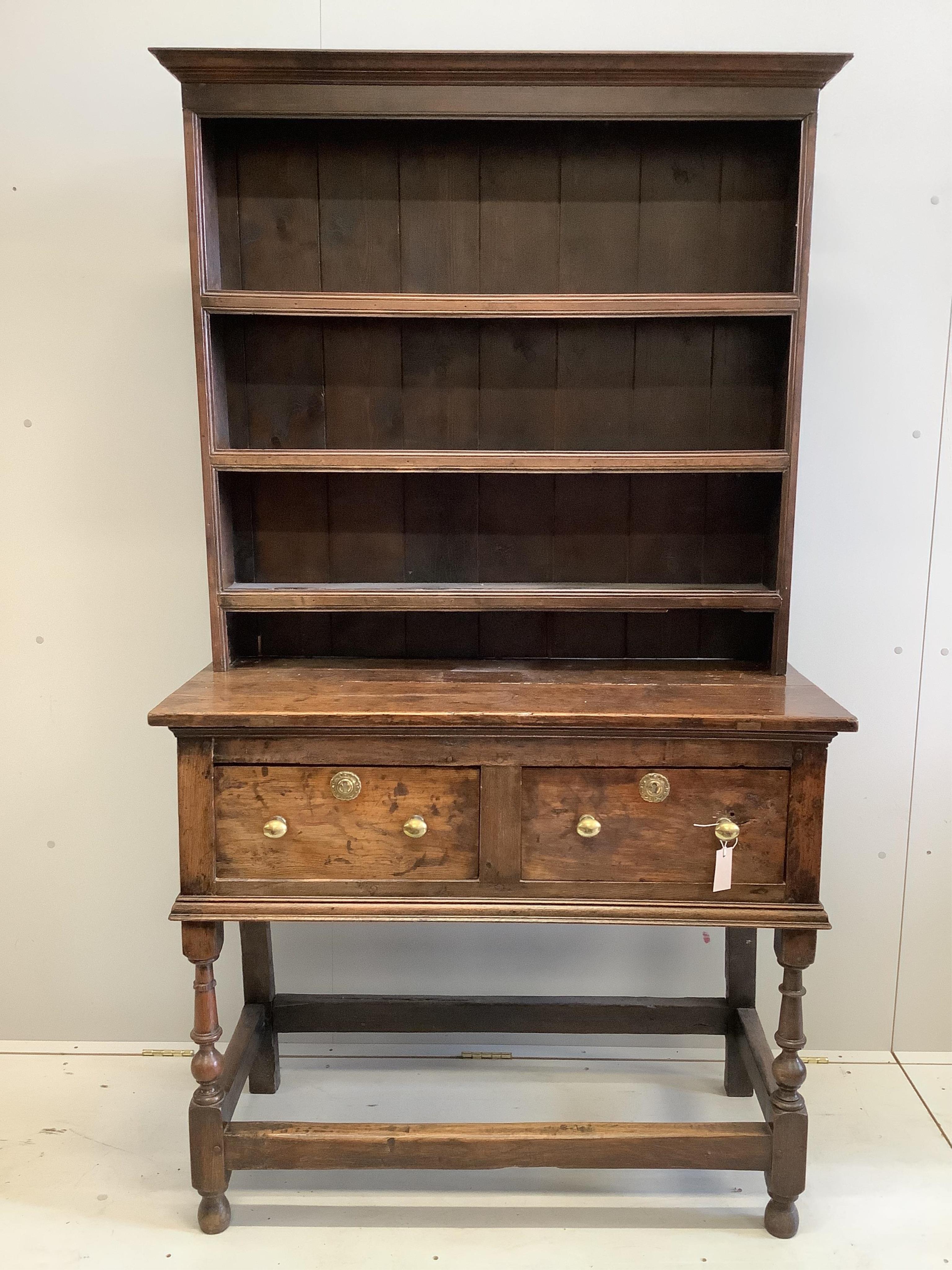 A small mid 18th century oak dresser, width 109cm, depth 49cm, height 191cm. Condition - poor to fair